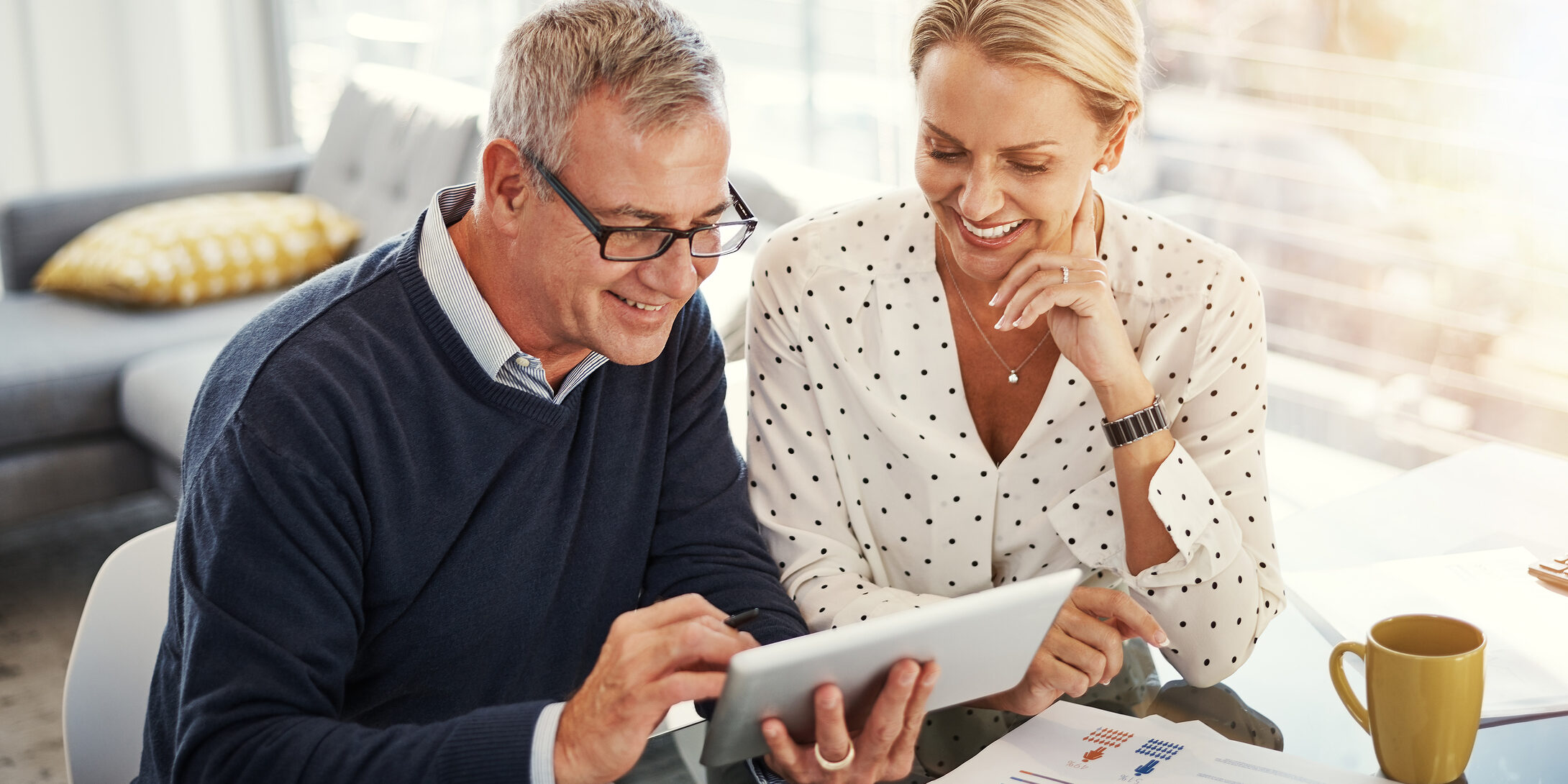 Reaching their savings goals with smart technology Couple Reviewing Retirement Plan